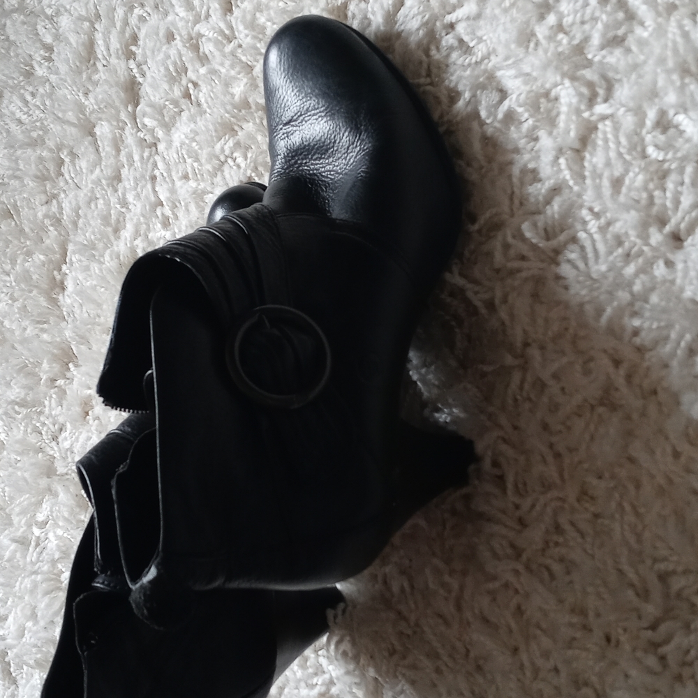 Born, black booties.
